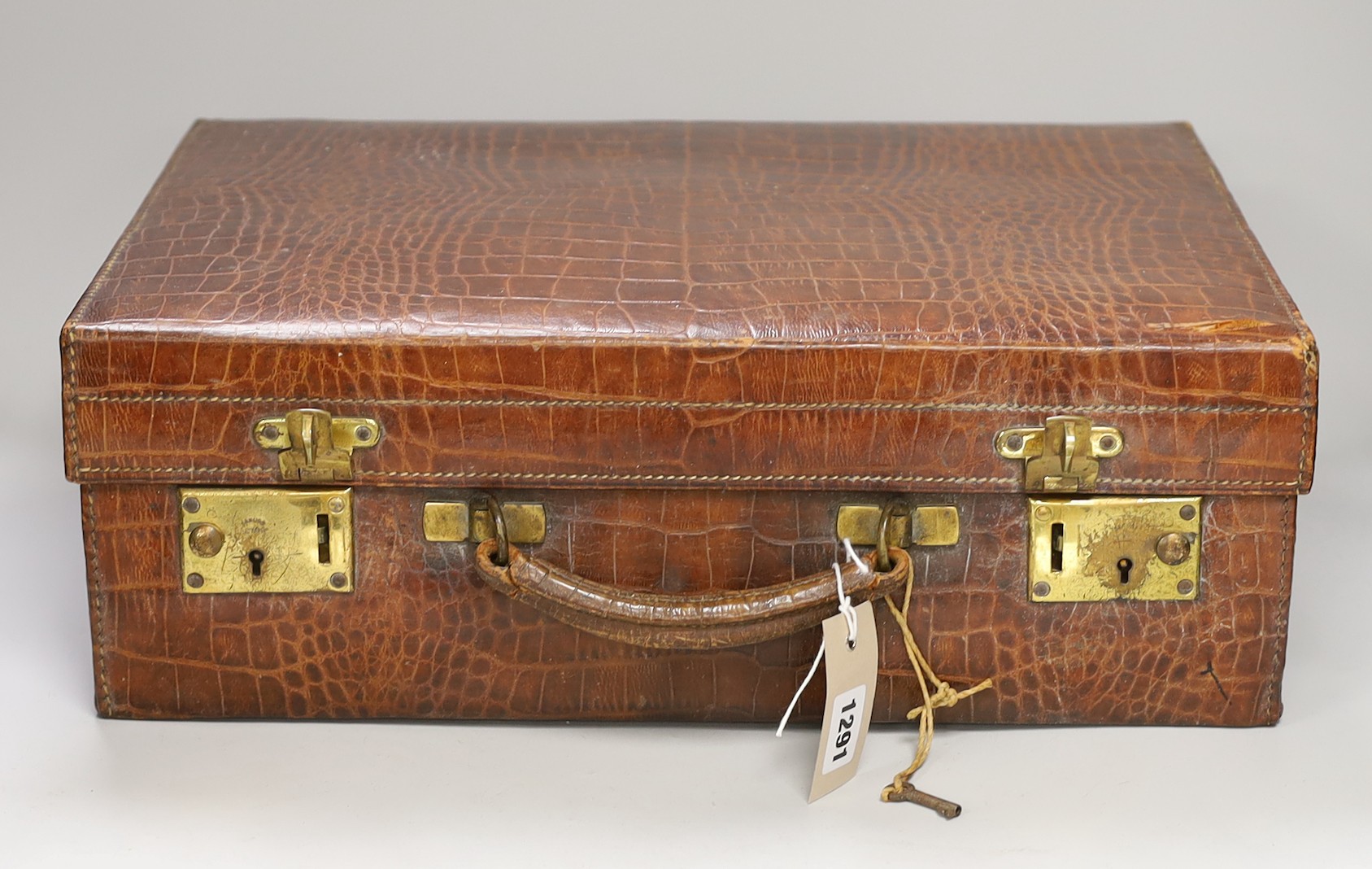A George V crocodile skin toilet case
